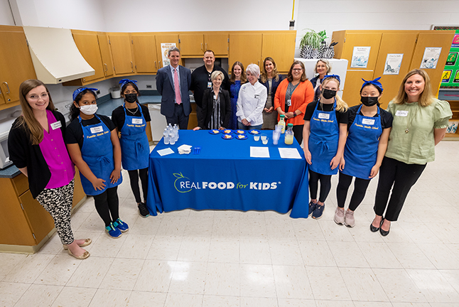 Franklin Middle School team members, and teachers Siri Jeffry and Jessica Spencer, showcased the culinary process and served samples to FCPS and Real Food for Kids officials, as well as School Board Chairwoman Stella Pekarsky.